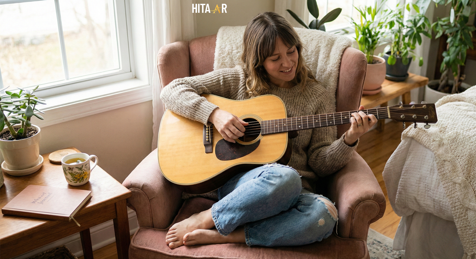 Person sitting with an acoustic guitar, practicing gentle chords as part of a self-care routine.