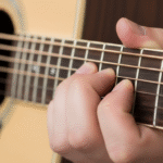 G minor barre chord shape on guitar fretboard for beginners.