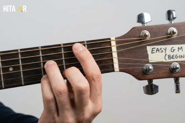GM chord finger placement on guitar fretboard showing correct position for clean sound.