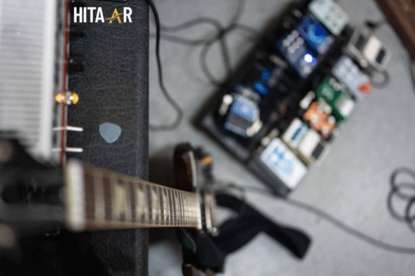 Guitarist using a setup with a guitar effect that mimics a voice for expressive tones