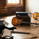 A modern electric guitar placed on a wooden surface with an amplifier in the background, representing different price ranges and guitar options for beginners and professional players.